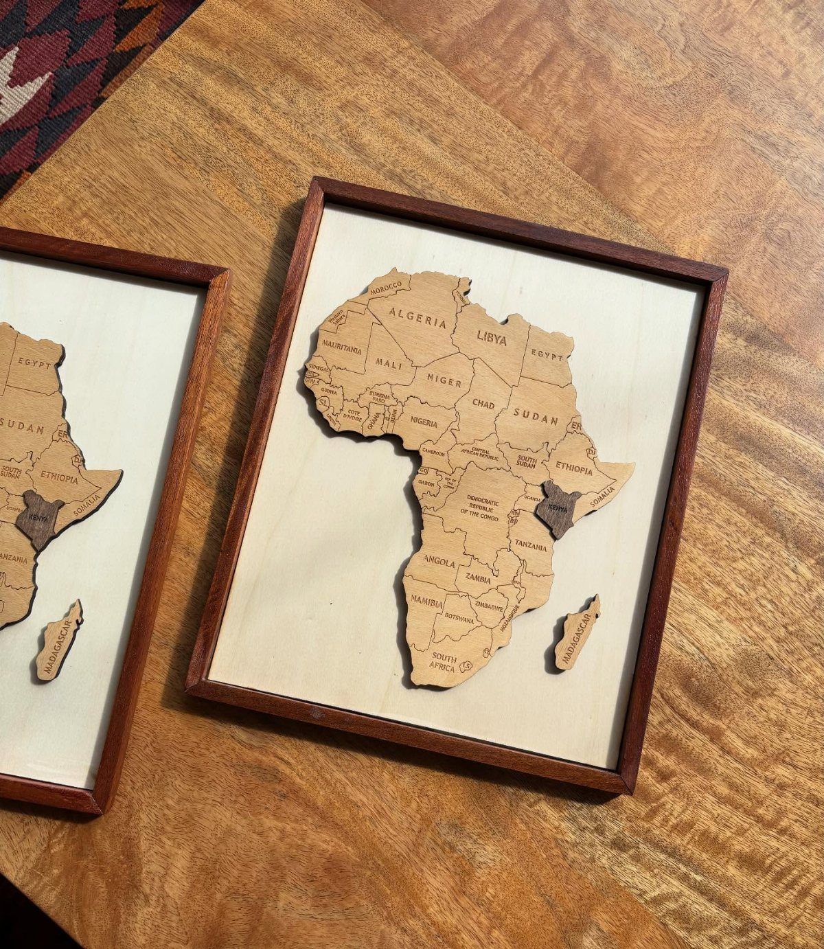 Wood Piece Art Ideas: 25 Designs for Walls and Shelves 13 Wooden map of Africa with engraved country names inside a square brown frame.