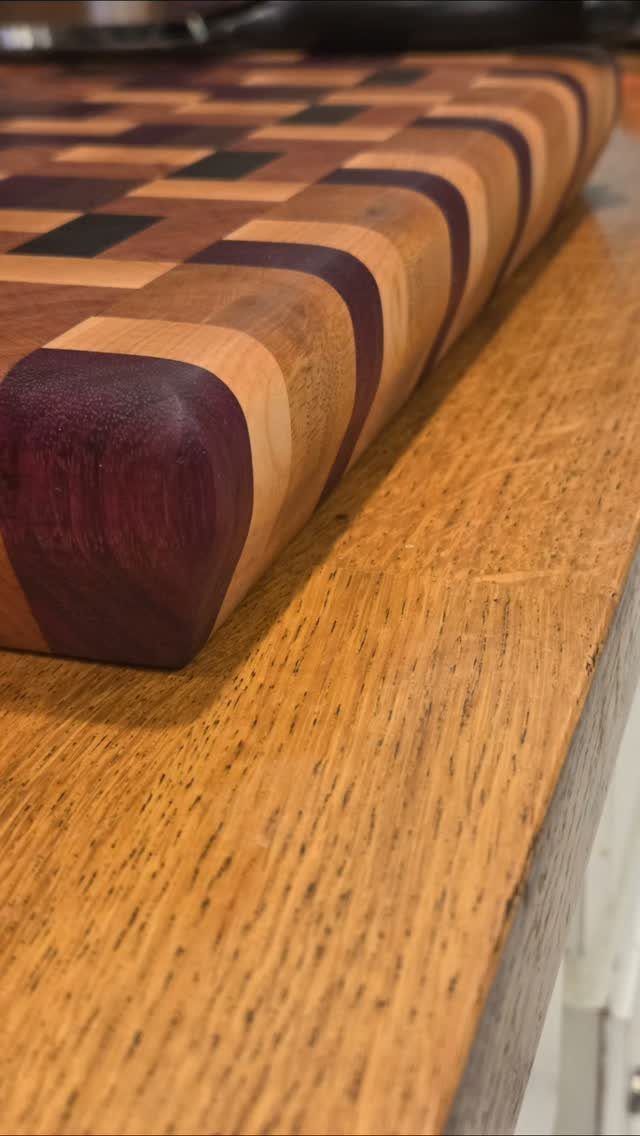 18 Wood Projects with Plans for Every Skill Level 1 End-grain wooden cutting board with a checkered pattern on a light wood surface.