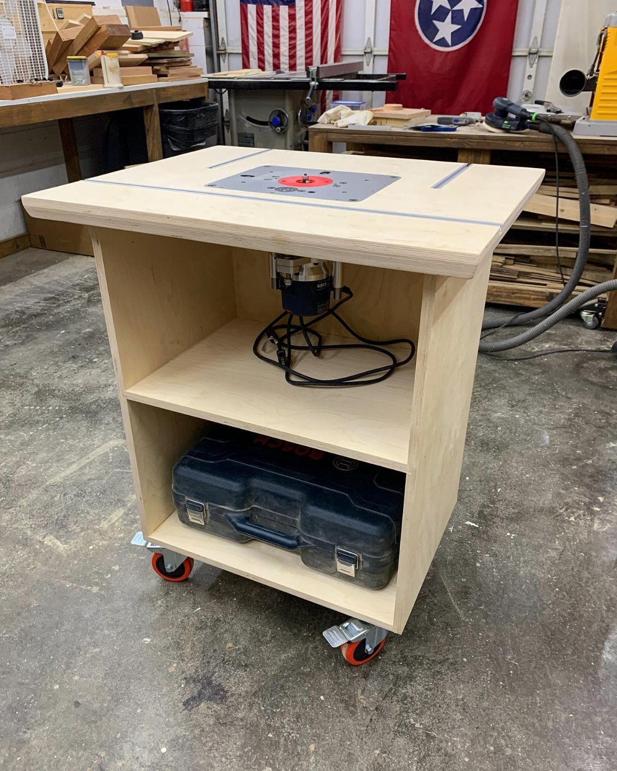 Wood Router Table Ideas: 6 Setups for Your Workshop 2 Wooden router table with a grey insert plate on a mobile plywood stand