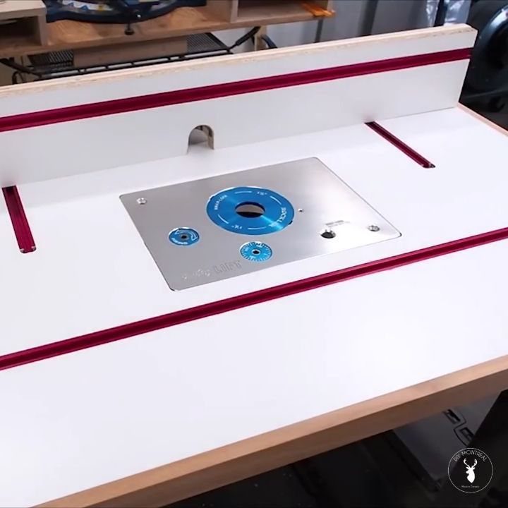 Wood Router Table Ideas: 6 Setups for Your Workshop 4 White wood router table with metal insert plate and red T-track rails.