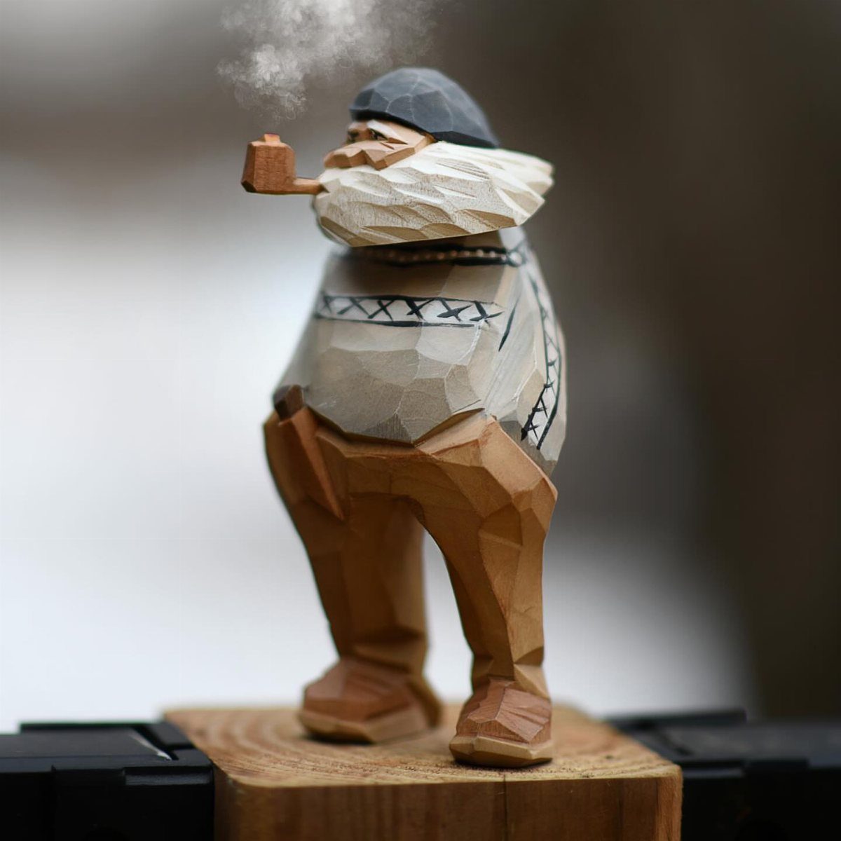 Wood Statue Carving: 6 Ideas from Mushrooms to Bears 6 Hand-carved wooden statue of a bearded man smoking a pipe on a wooden base.