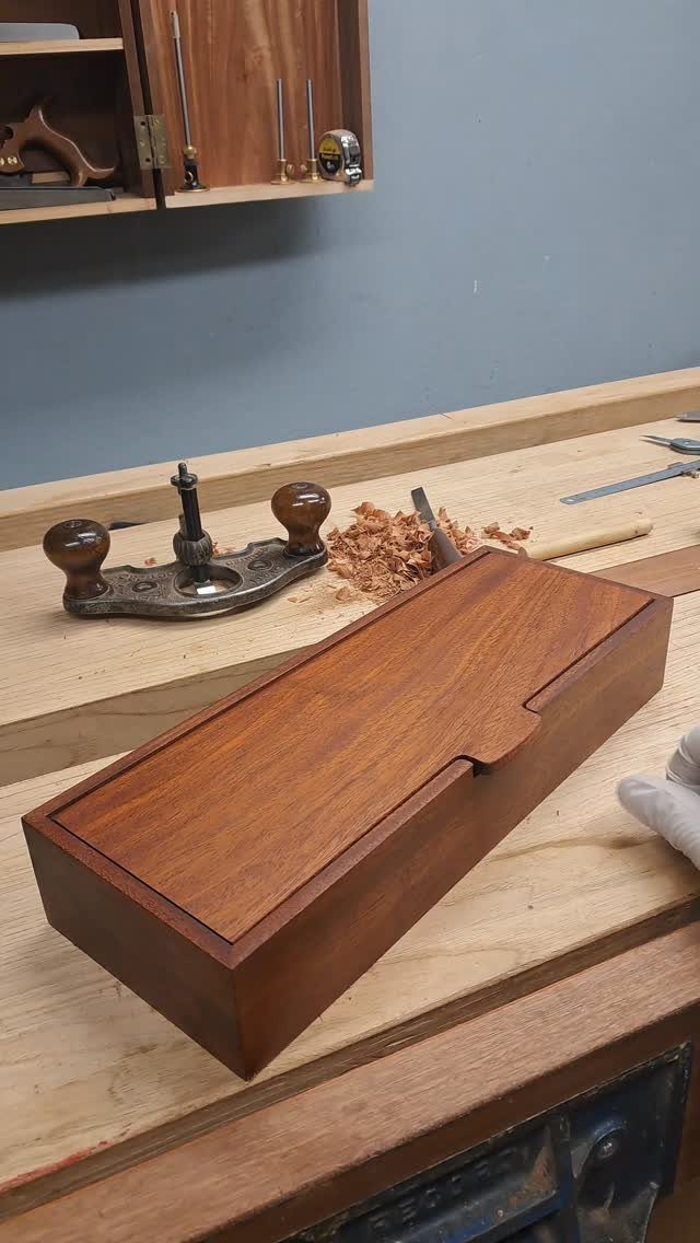 7 Wooden Box Designs for Jewelry, Tissue and Storage 7 Rectangular brown wooden box with a lid on a carpenter's workbench.