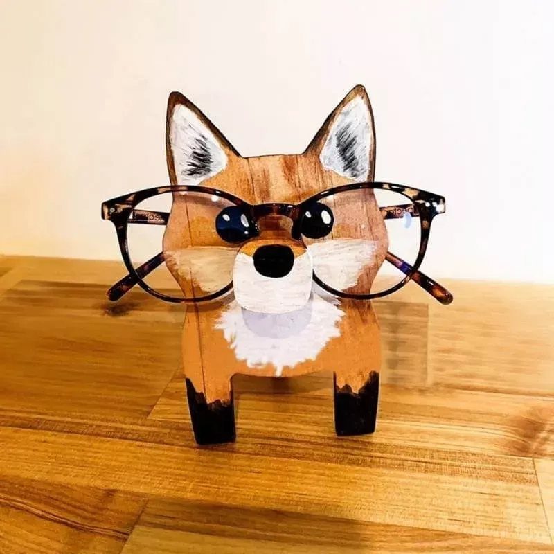 Wooden Glasses Holder: 10 Ideas for Every Desk 8 Fox shaped wooden eyeglass stand holding a pair of tortoiseshell glasses.