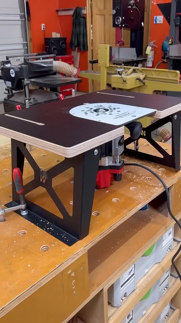 Woodpeckers Router Table Setups: 5 Ideas for Your Shop 1 Woodpeckers router table with black legs and brown top on a wooden workbench