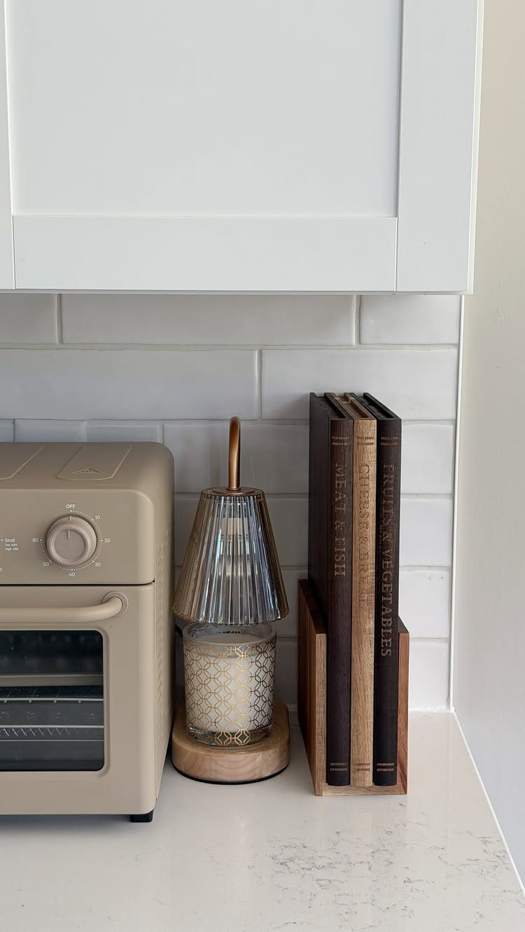 Woodworking Book Holder Ideas: 4 Designs to Build 4 Wooden book holder with three cookbooks on a white kitchen countertop
