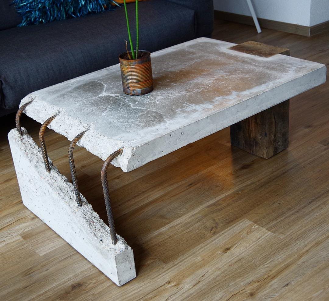 9 Woodworking Coffee Table Ideas for Every Skill Level 1 Concrete and wood coffee table with a thick slab top and block base.