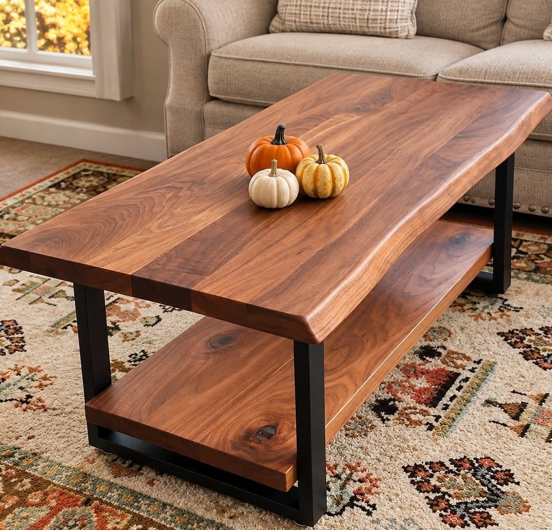 14 Woodworking Ideas to Make Money From Your Shop 6 Live-edge wooden coffee table with black metal legs and small pumpkins on top.